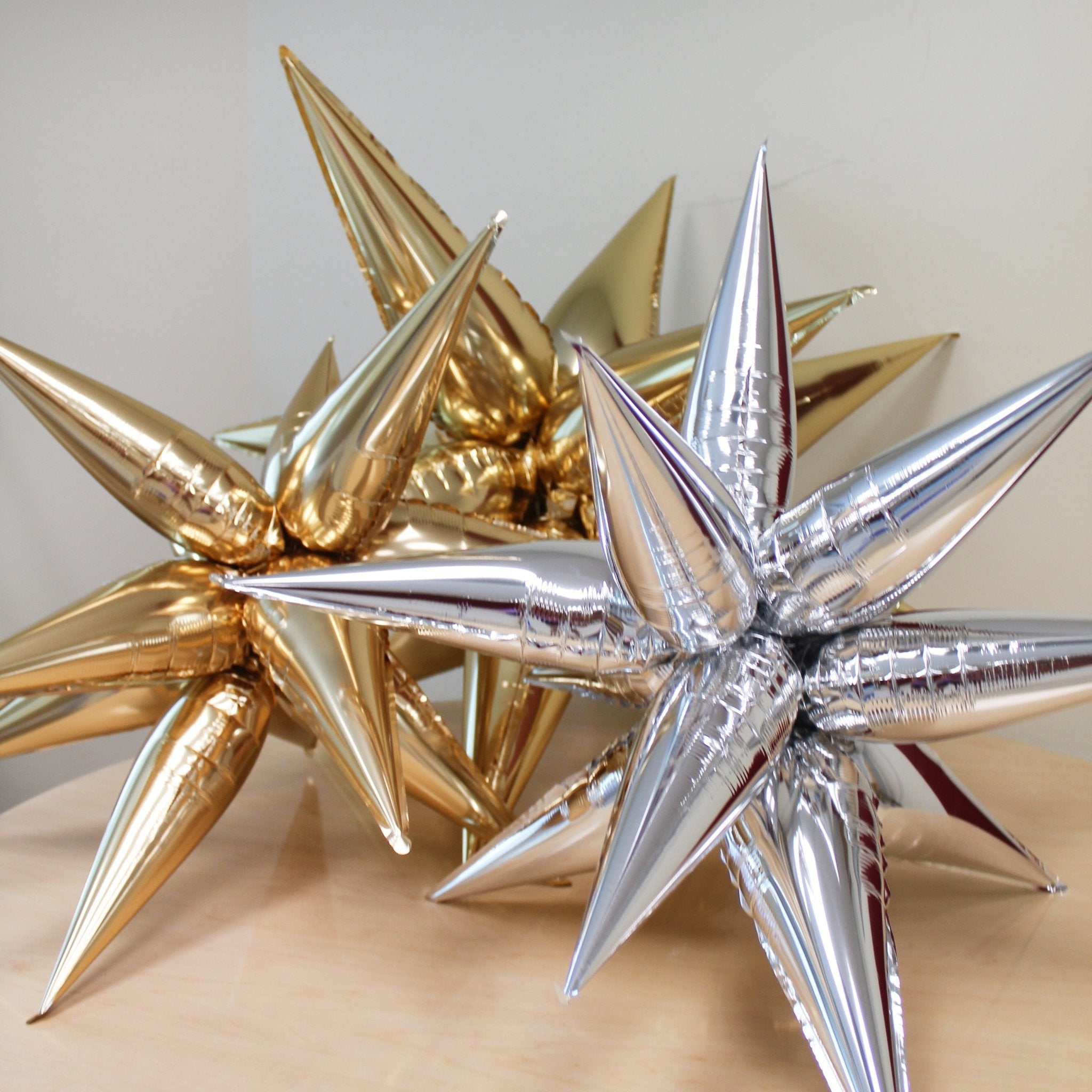 Silver Starburst Cluster Balloon | 12-Point Metallic Foil Star